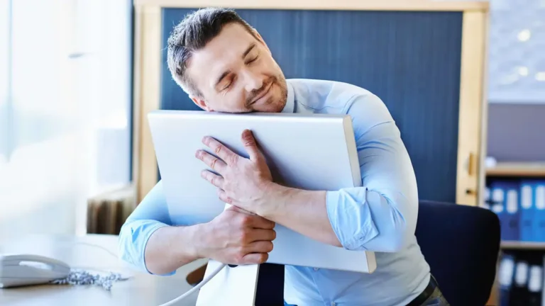 businessman hugging his digital signage, Reach Media Network
