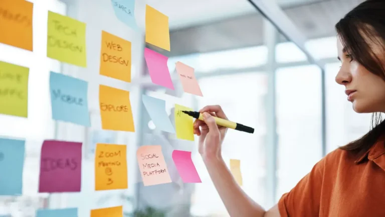 businesswoman having a brainstorming session in a modern office, Reach Media Network digital signage