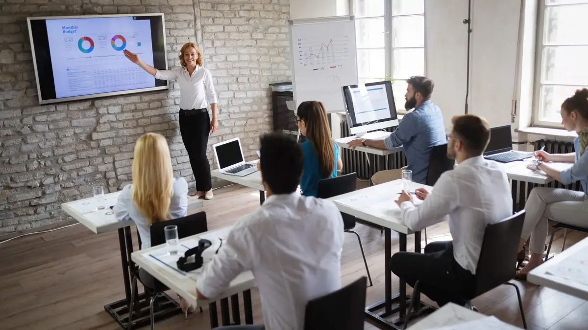 education digital signage example from Reach Media Network displaying infographics and corporate metrics