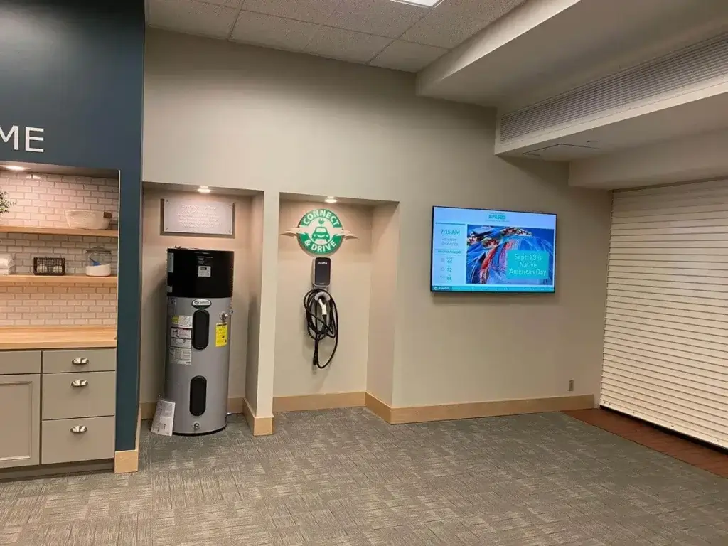 Snohomish county public utilities department screen featured at entrance, displaying holiday announcements.