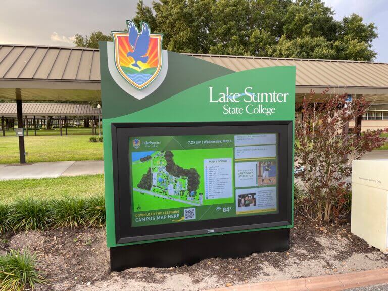 Lake-Sumter State College outdoor digital signage displaying campus wayfinding map, upcoming events, social media, and QR codes to maps
