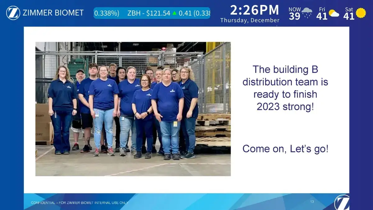Zimmer Biomet manufacturing digital signage software from Reach Media Network displaying team messaging and local weather, featured in the break room.