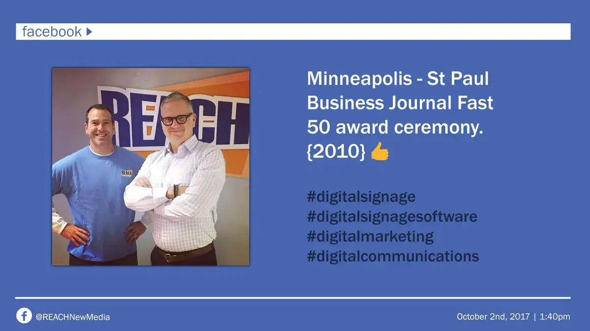 Digital signage screen displaying Facebook social media post for REACH Media Network and Business Journal Fast 50 award ceremony.