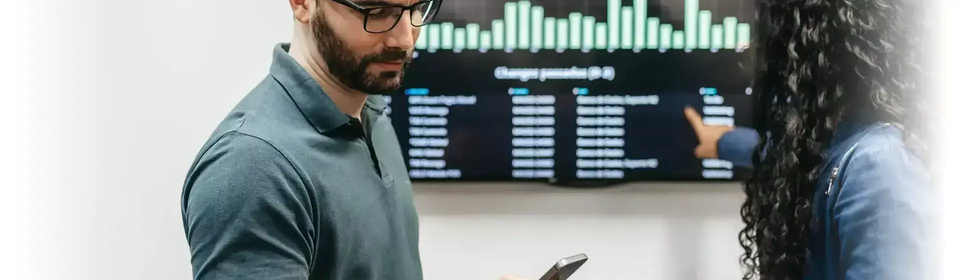 two people setting up a digital signage display, Reach Media Network Digital Signage Hardware guide