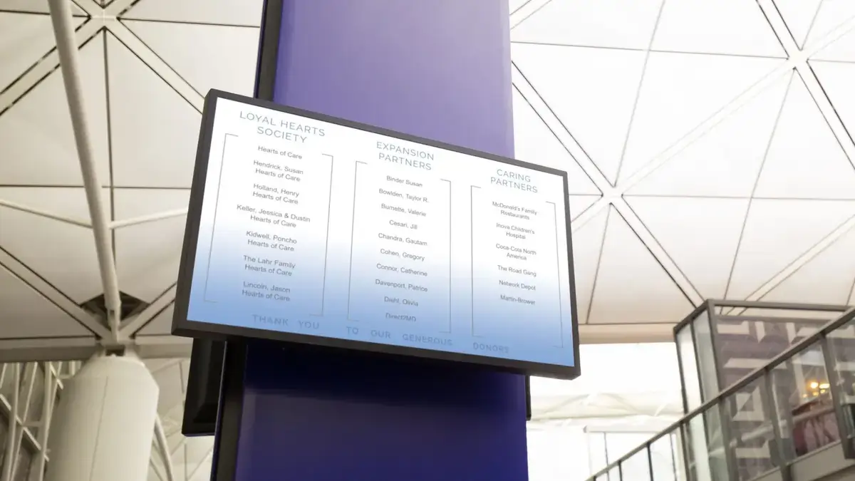 Digital signage software from Reach Media Network displaying donor names.