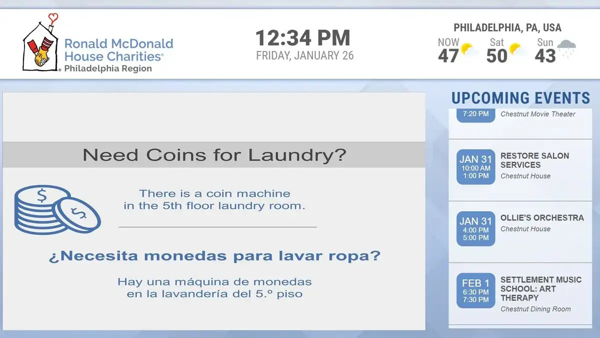 Ronald McDonald House Charities digital signage screen from Reach Media Network displaying weather, announcements, and upcoming events.