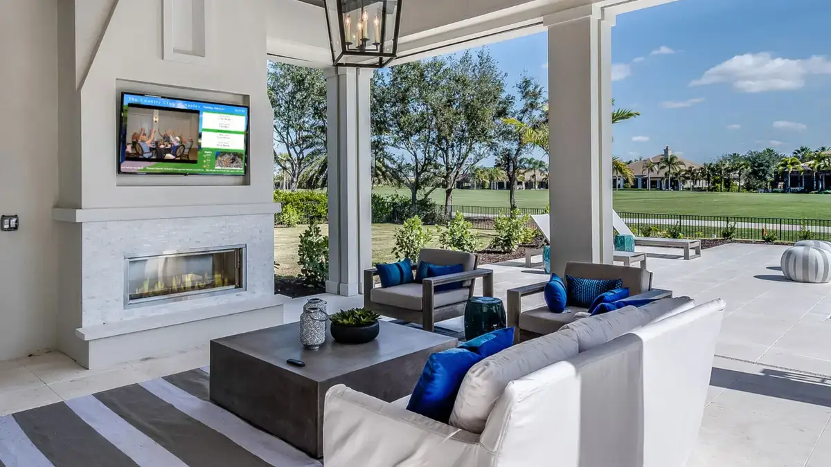 Outdoor digital signage from Reach Media Network featured on an outdoor lounge at the Country Club of Naples
