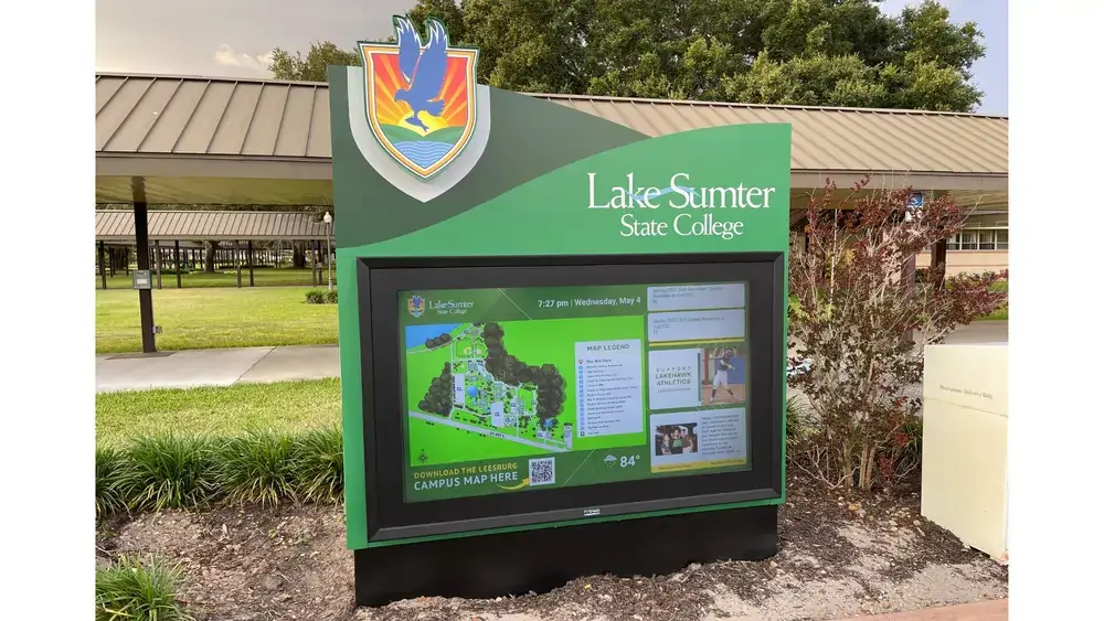 Lake Sumter State College outdoor signage from Reach Media Network displaying QR code, campus map, events, and social media.