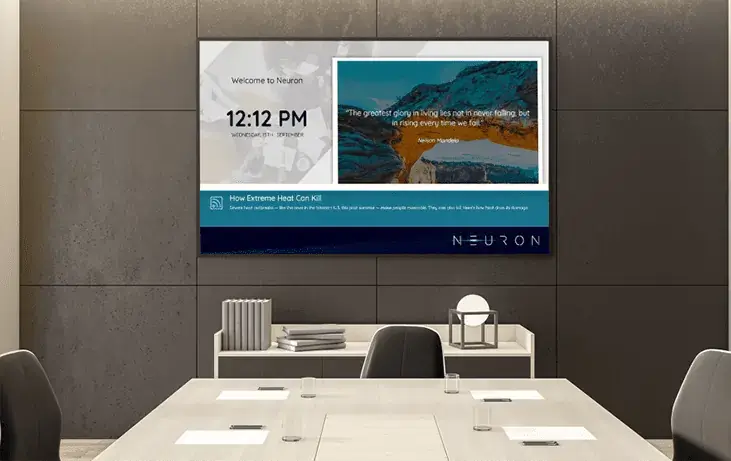 conference room digital signage from Reach Media Network displaying date and time, quote and facts