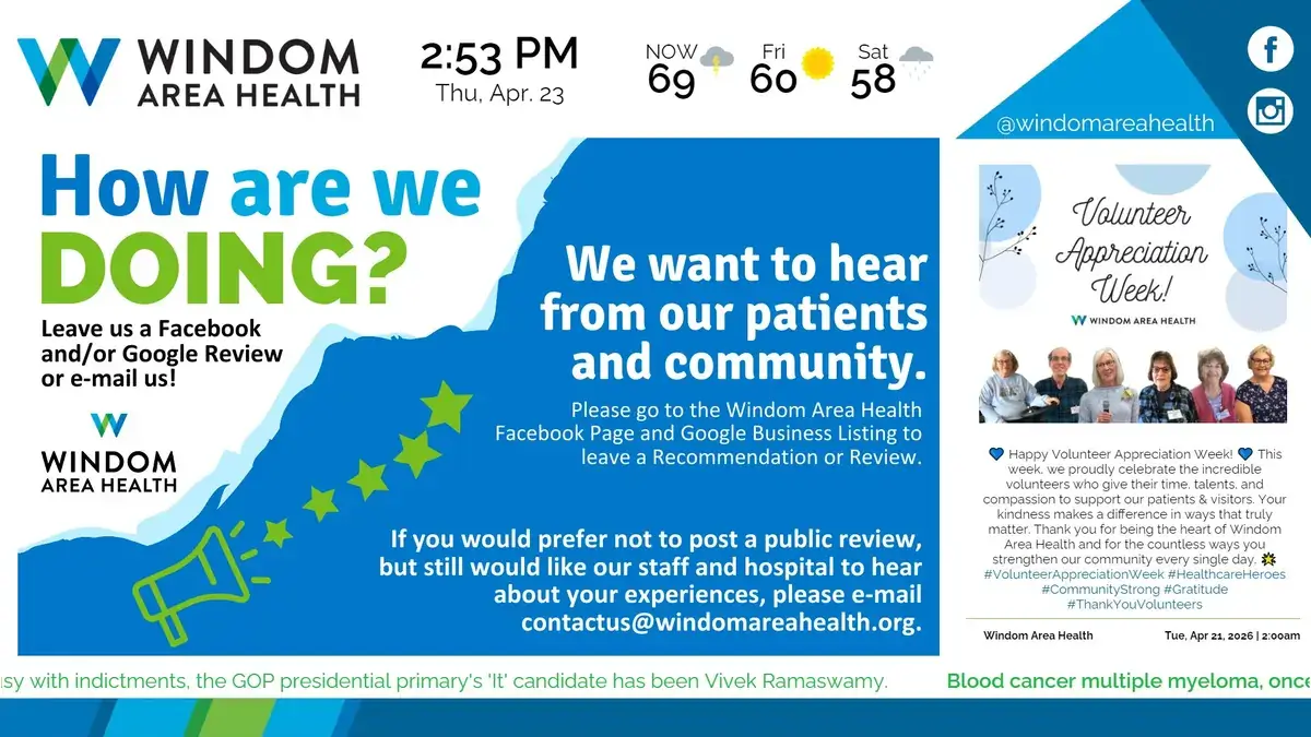 Windom Area Health digital signage screen from Reach Media Network displaying announcements, social media feed, news headlines, and weather