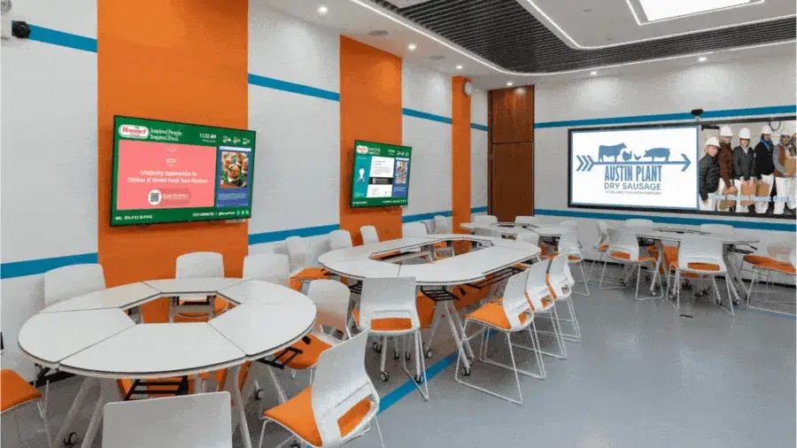 Reach-Media-Network-break-rooms-digital-signage-solutions Wall-mounted digital displays in a cafeteria break room.