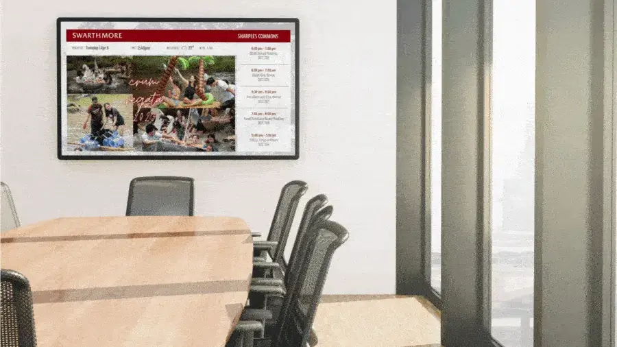 Reach-Media-Network-collaborative-spaces-digital-signage-solutions A well-lit conference room with wall-mounted tv, showcasing REACH Media Network software.